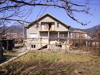 Two storey house at the foot of the mountain